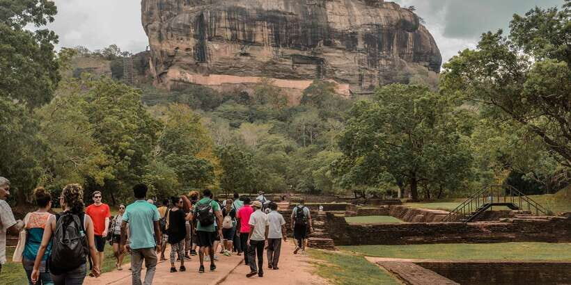 From Kandy: Sigiriya and Dambulla Private Day Tour - Dambulla Cave Temple and the Golden Temple: caves, murals, and a giant golden Buddha